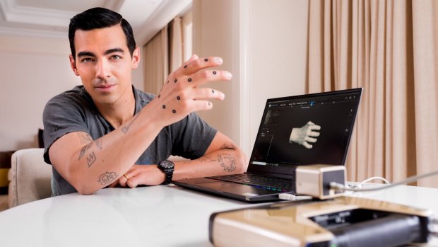 Expedia used a 3-D printer to make resin replicas of singer-actor Joe Jonas's right hand.