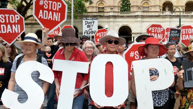 Anti-Adani protesters protest outside Queensland's Parliament House in Brisbane.