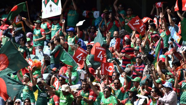 Bangladesh fans celebrate a boundary at the Adelaide Oval on Monday.