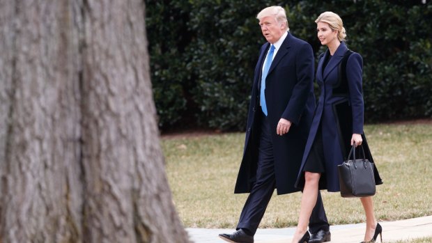 US President Donald Trump and his daughter Ivanka walk to board Marine One on the South Lawn of the White House in Washington on Wednesday.