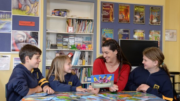 Student welfare officer Prue Robertson with students from Campbells Creek Primary School.