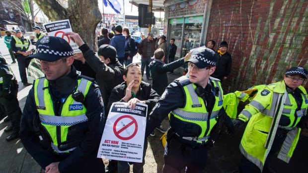 Police at the rally in Richmond for a safe injecting room.