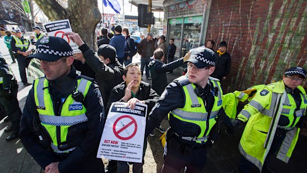 Police at the rally in Richmond for a safe injecting room.