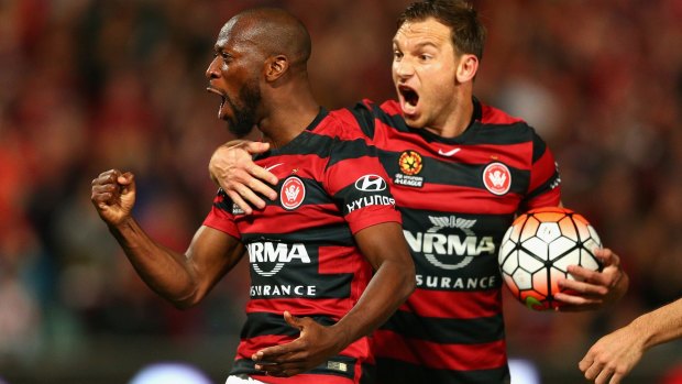 Wanderers Romeo Castelen and Brendon Santalab celebrate during their semi-final win over the Roar.