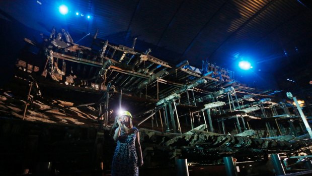 Head of Conservation Eleanor Schofield  in front of the hull of Henry VIII's warship, the Mary Rose.