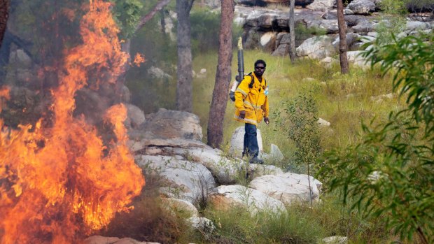 Rangers control a wildfire in the southern area of the Warddeken Indigenous Protected Area, close to Kakadu.