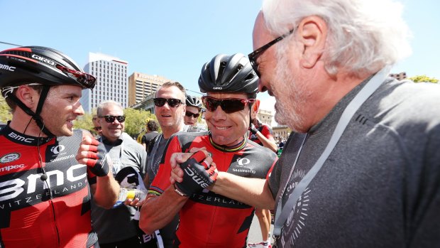 Cadel Evans with BMC Racing team owner Andy Rhis (right) after the end of stage 6 of the Tour Down Under on Sunday.
