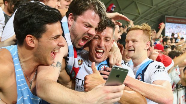 Melbourne City's Robi Koren celebrates with fans after the derby win.