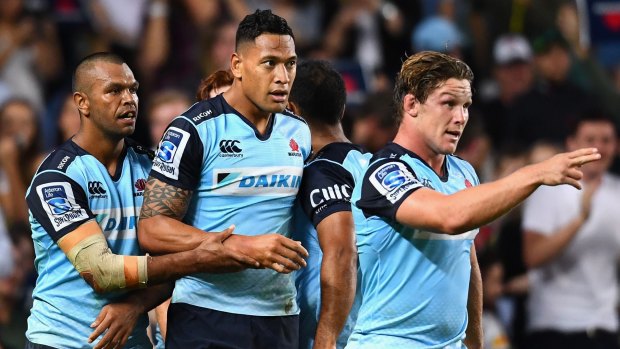 Praise: Israel Folau is congratulated after scoring a try against the Brumbies.