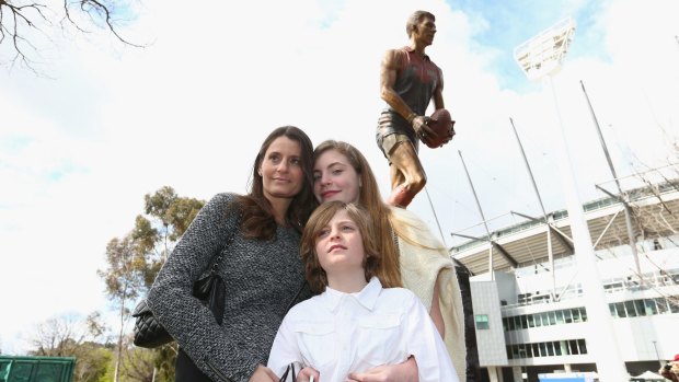Samantha Stynes and children Matisse and Tiernan at the unveiling of the Jim Stynes statue at the MCG.