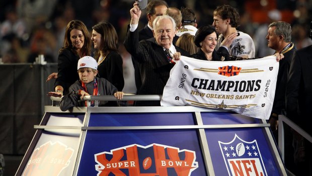Sweet success: New Orleans Saints owner Tom Benson celebrates with the Vince Lombardi trophy after his team defeated the Indianapolis Colts during Super Bowl XLIV in 2010 at Sun Life Stadium in Miami.