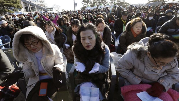 South Koreans pray for reunification during a New Year's service near the border.