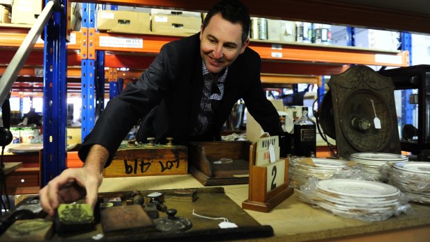 All Bids chief executive officer Rob Evans with a private collection of items from Old Parliament House, Government House, The Lodge, CSIRO and government departments that will be auctioned. 