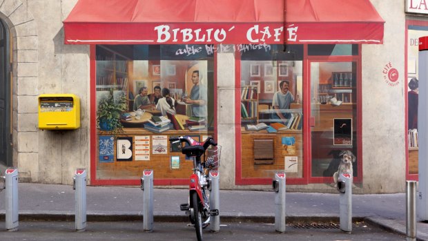 A wall in Lyon painted in trompe l'oeil style representing a cafe bookshop. 