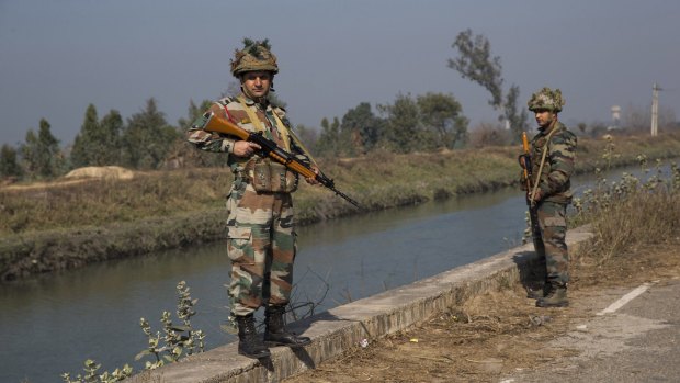 Indian soldiers guard the Munak canal, near the village of Bindroli, in the northern state of Haryana on Monday.