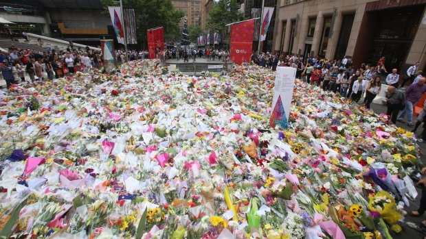 Martin Place is covered in thousands of floral tributes. 