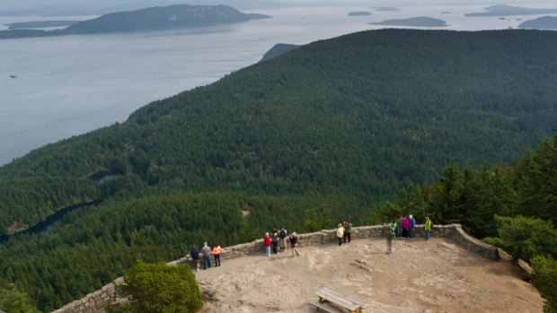 People enjoy the view from the top of Mount Constitution, Moran State Park, Orcas Island.
