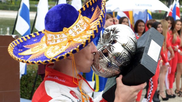 Meeke kisses his Mexico WRC trophy - and thanks his lucky stars.