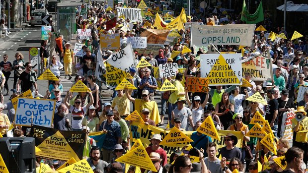 Hundreds of fracking protesters marched along Bourke street to the steps of Parliament House.