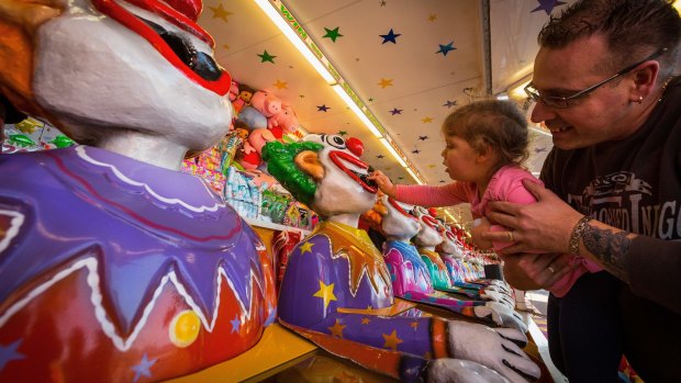 Mia, 3, Daniel Dukic enjoy the clowns on the first day of the Royal Melbourne Show.  