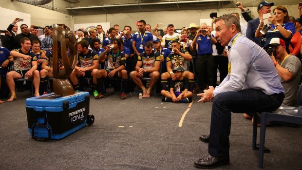 Job done: Cowboys coach Paul Green talks to his players after the 2015 grand final.