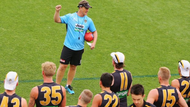 All bets are off: Tigers head coach Damien Hardwick speaks to his players during a training session. Richmond will no longer have any sponsorship deals with sports betting agencies. 