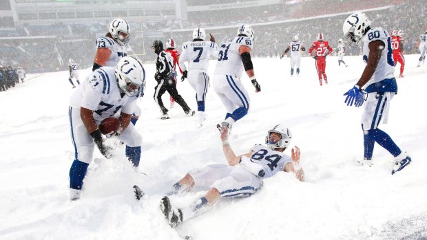 Indianapolis Colts tight end Jack Doyle (centre) celebrates in the end zone.