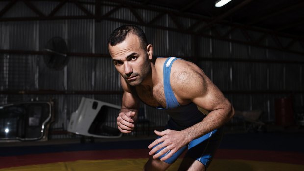 Iranian asylum seeker and champion wrestler Amir Gholizadeh wants the chance to compete in the Commonwealth Games.