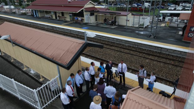 Queensland premier Campbell Newman speaks to the press at Landsborough Railway Station.