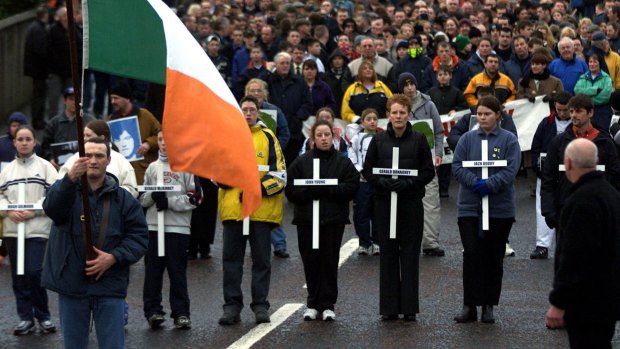 Thousands march in Londonderry in 2000, in memory of fourteen people who were shot dead by British paratroopers in the city in 1972. 