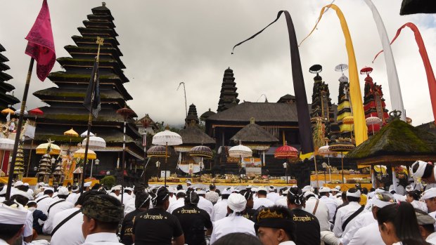 Hundreds of Balinese pray at the full moon ceremony.