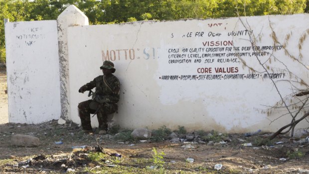 A Kenya Defence Forces soldier secures the area around the Garissa University college, in Garissa, Kenya.