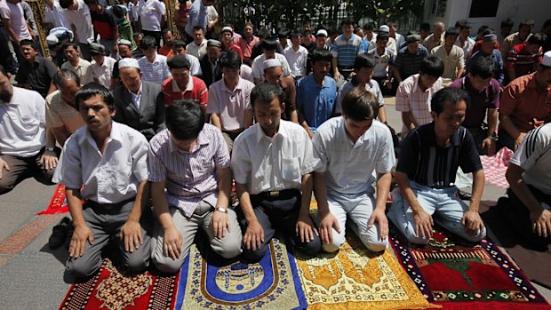 Uighur men pray in a mosque in Urumqi, the capital of western China's Xinjiang province. 