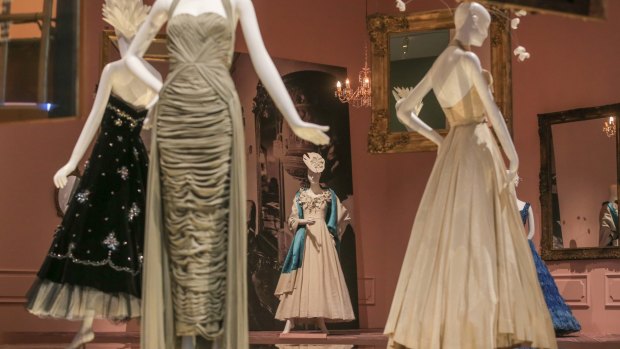 A halter-necked 1950s evening gown by Georges of Melbourne (second from left) in the National Gallery of Victoria's 200 Years of Australian Fashion.