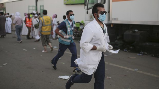 Medics rush to the site where pilgrims were crushed and trampled to death during the annual hajj pilgrimage in Mina, Saudi Arabia, on Thursday.