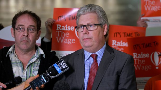 Grassroots: Low-paid worker Matthew Osborne with Dave Oliver from the ACTU at the fair work decision.