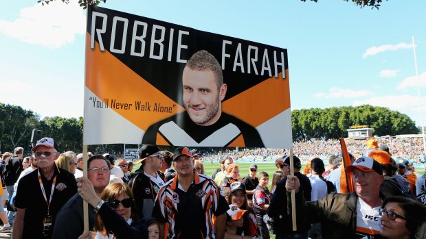 Departing son: The Robbie Farah faithful pay tribute to their hero.