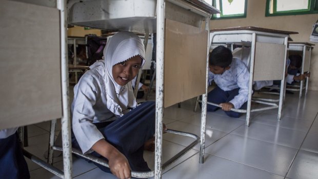 Lhok Nga school students practice a tsunami drill.