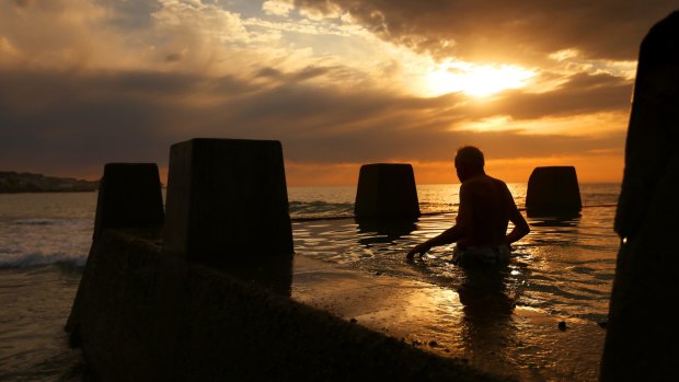 A man enters the water at the baths at Coogee Beach earlier this week.