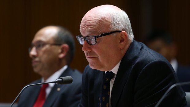 Department of Foreign Affairs and Trade secretary Peter Varghese  and Attorney-General George Brandis appear at a Senate estimates hearing.