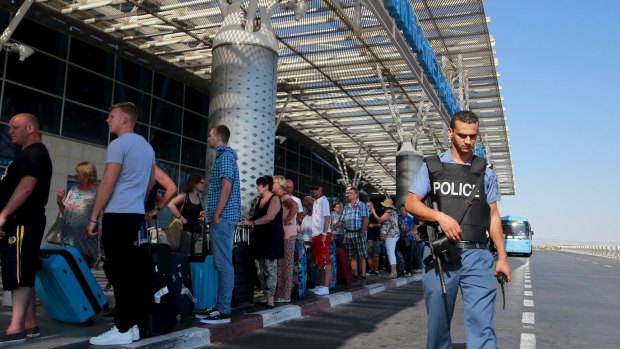 Thousands of tourists rushed to leave Tunisia after Britain warned another attack was "highly likely", two weeks after a gunman killed 38 foreign holidaymakers at a beachside hotel.