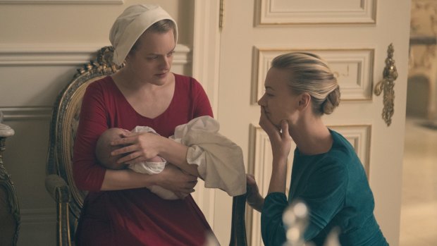 Offred the handmaid, played by Elizabeth Moss, and commander's wife Serena Joy, played by Yvonne Strahovski. Women in the fictional republic of Gilead have to play one of a limited number of proscribed roles.
