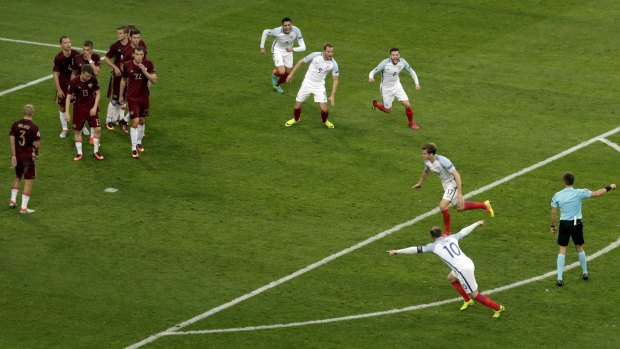 Nice strike: England's Eric Dier and his teammates celebrate their side's opening goal.