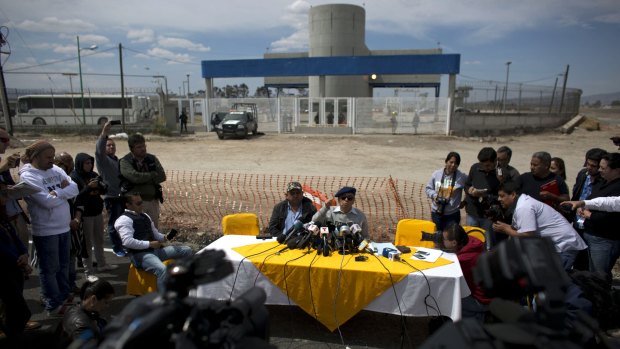 Jose Luis Gonzalez Meza, centre, one of Joaquin "El Chapo" Guzman's lawyers, holds a press conference outside the gates of Altiplano maximum security prison to announce he would begin a hunger strike in protest over the drug lord's treatment inside the prison, near Toluca, Mexico.