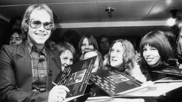 Elton John signing autographs in 1973. 