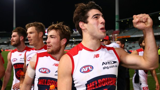 Christian Petracca, celebrating after beating the Eagles, is one of a long list of versatile midfielders and utility players at the Demons.