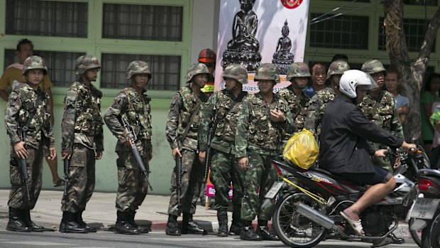 Thai soldiers patrol near government buildings last year after the army seized power. 