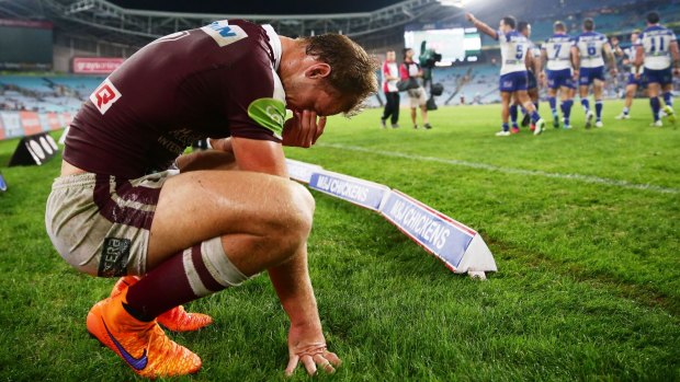 Dejected: Daly Cherry-Evans is shattered after Canterbury's final try to Corey Thompson at ANZ Stadium.