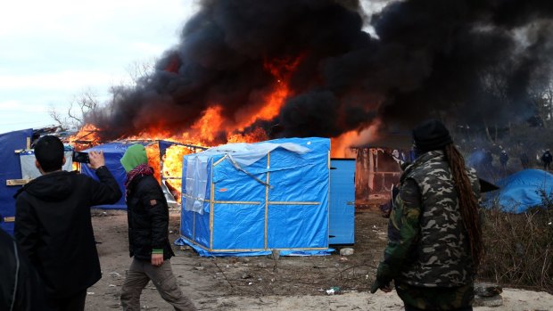 French authorities began dismantling part of the migrant encampment in the northern French town of Calais and relocating people to purpose-built accommodation nearby on Monday.