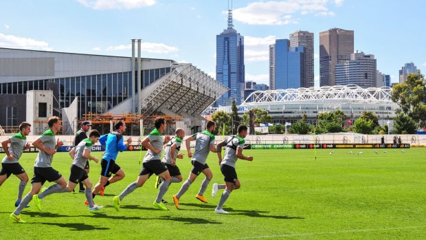 Kinetic diplomats: Socceroos players train at Collingwood in preparation for the Asian Cup.